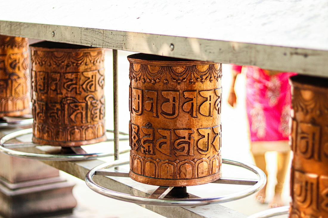 a group of metal cups sitting on top of a table