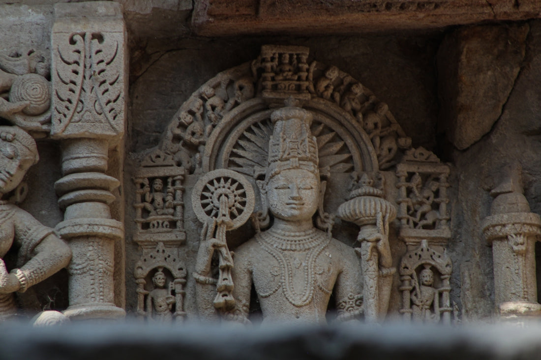 a close up of a statue on a building