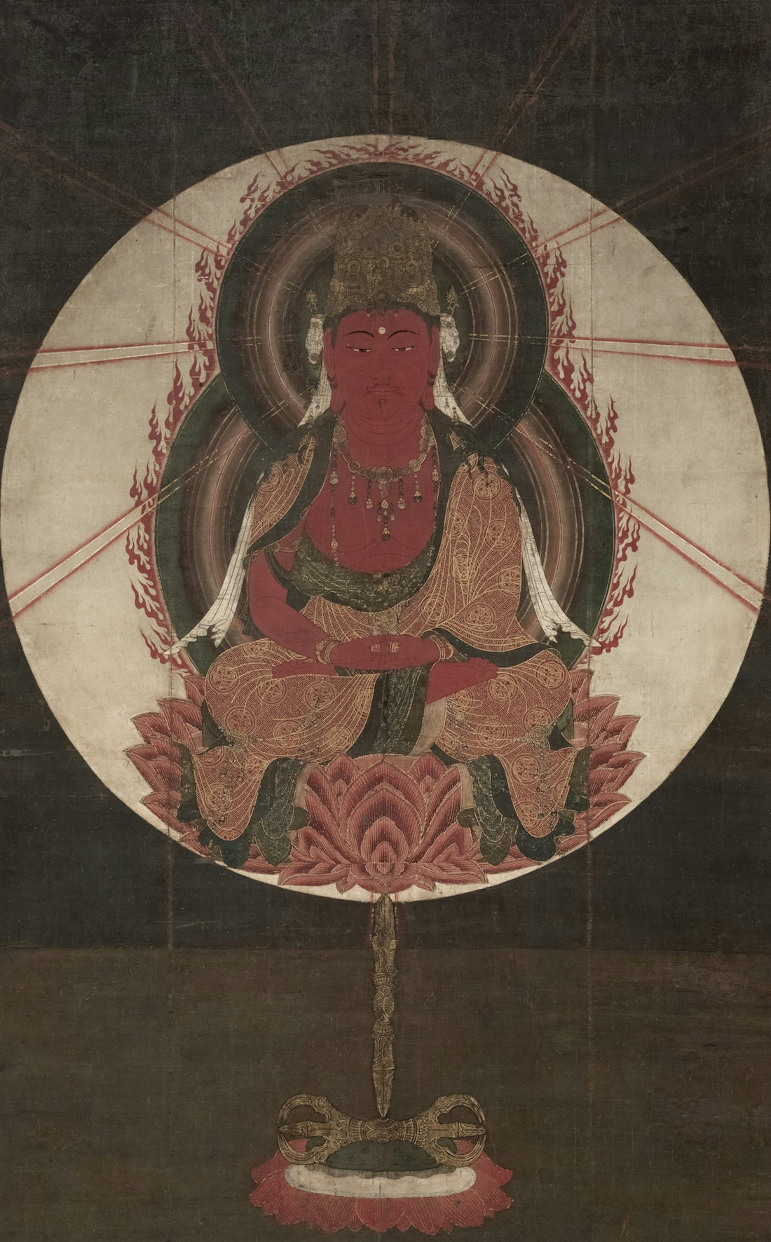 Red deity seated on lotus with radiant halo