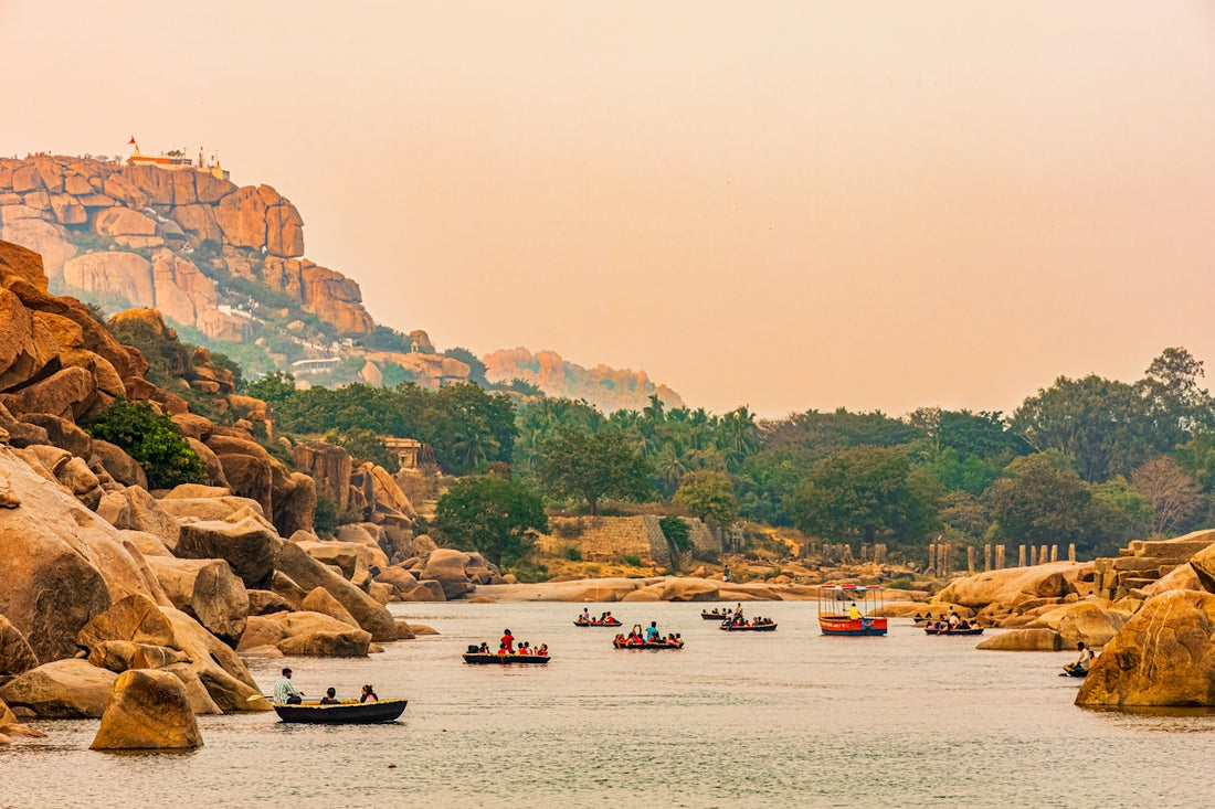 A group of boats floating on top of a lake