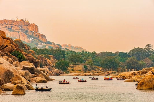 A group of boats floating on top of a lake