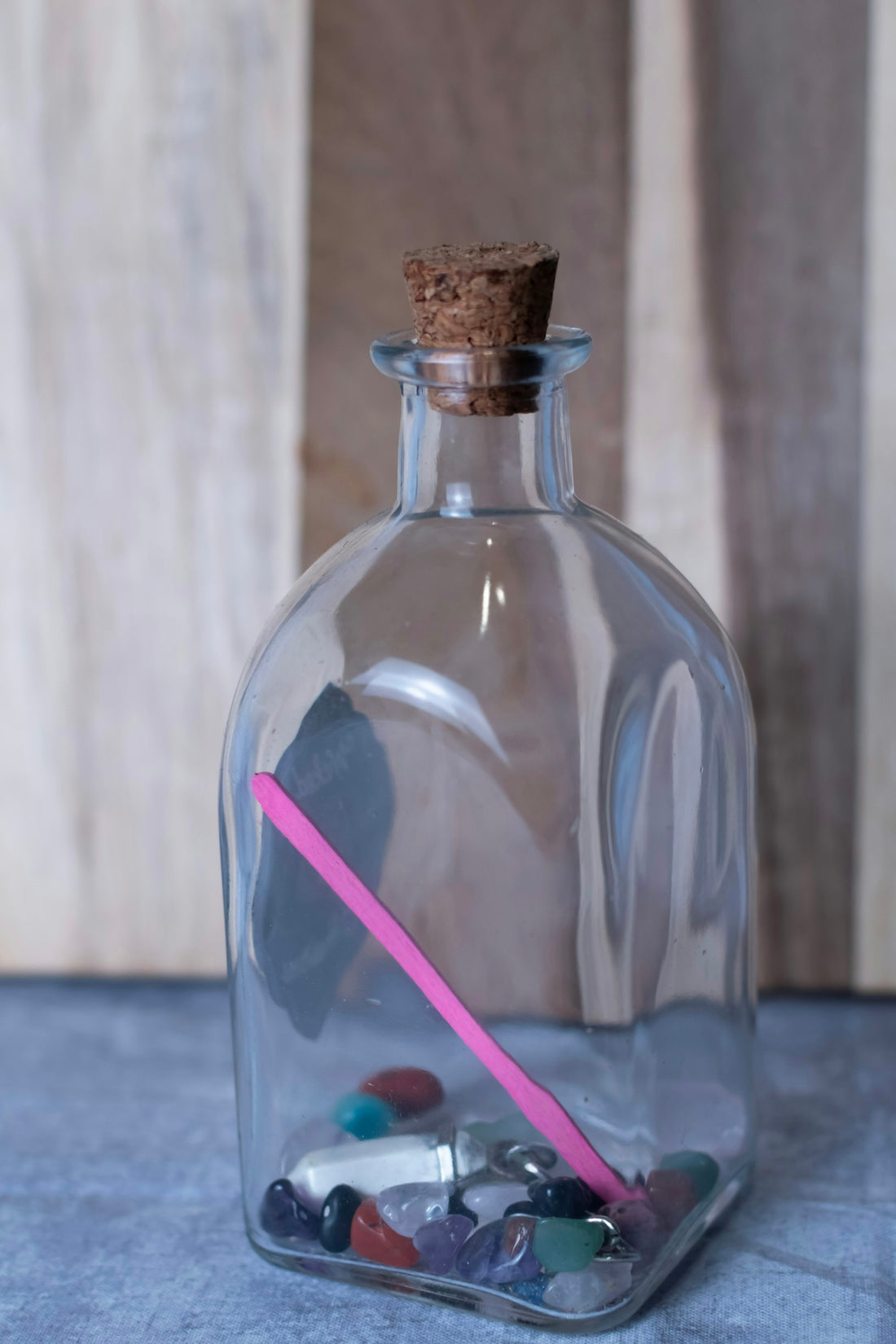 Message in a bottle with colorful stones