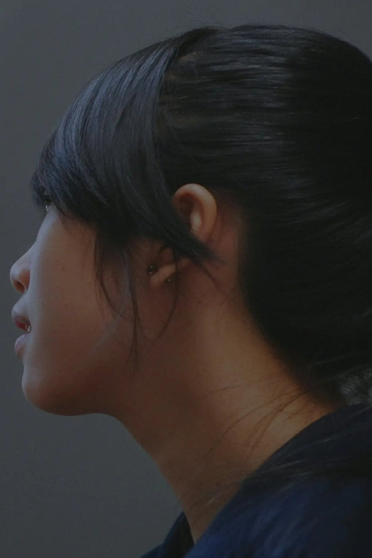 Profile of a young woman with dark hair