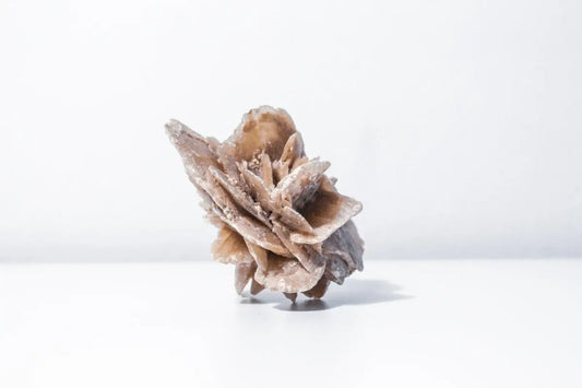 a piece of wood sitting on top of a white table